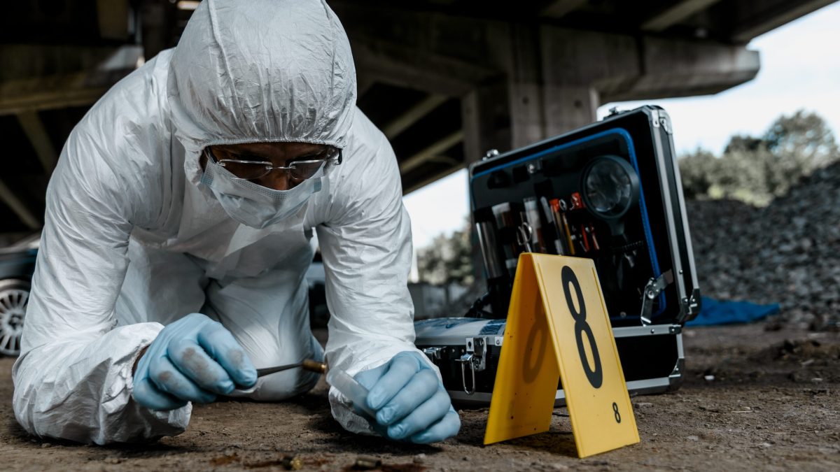 Senior forensic scientist working at crime scene