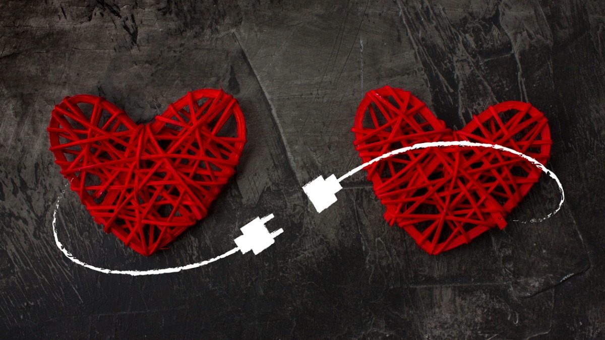 two-hearts-connected-by-usb-cable-theme-of-love-wedding-valentines-picture-id916664636